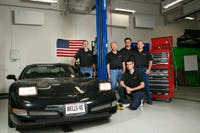 Tech Team In Garage Setting Tech Team In Garage Setting