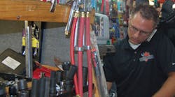 Matt Sledge makes arrangements for the silent auction on July 30 in LaVergne, Tenn. Matt Sledge makes arrangements for the silent auction on July 30 in LaVergne, Tenn.