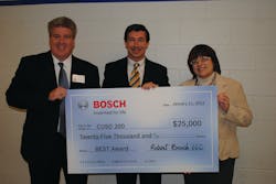 David Coolidge, Executive Vice President, Americas, Robert Bosch LLC, (center) presented the award to Board of Education President, Rosemary Swanson and Superintendent Dr. Brian Harris at a recent school board meeting.