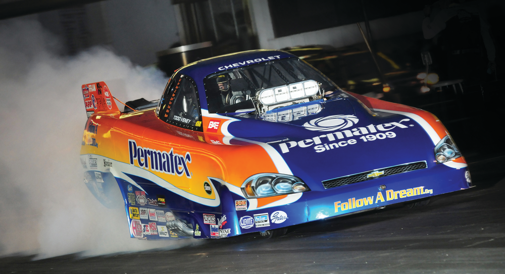 The Follow A Dream/Permatex 2008 Chevrolet Impala SS Top Alcohol Funny Car in burnout.