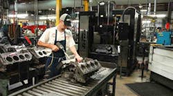 Operator installs torque plate on the block before setup in the Sunnen SV-410 machine or CK-21 immediately to the right in photo. Operator installs torque plate on the block before setup in the Sunnen SV-410 machine or CK-21 immediately to the right in photo.