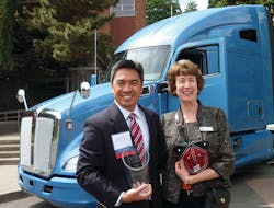 Shown in front of the new Kenworth T680 are, from left, Reid Nabarrete, Kenworth assistant general manager for operations, and Jean Jacoby, associate dean of the College of Science and Engineering at Seattle University. Nabarrete recently accepted a special award on Kenworth&rsquo;s behalf in recognition of Kenworth&rsquo;s long-time, ongoing support of the university&rsquo;s Project Center.