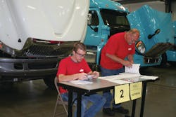 Jacob Gaylor, Mid-America Technology Center post-secondary student, ponders an electrical problem alongside Clarence Preston, Cummins Southern Plains technician, in the 2012 Oklahoma SuperTech Competition. Gaylor won 1st place honors in the student category and also won the Fastener Work Station. Jacob Gaylor, Mid-America Technology Center post-secondary student, ponders an electrical problem alongside Clarence Preston, Cummins Southern Plains technician, in the 2012 Oklahoma SuperTech Competition. Gaylor won 1st place honors in the student category and also won the Fastener Work Station.