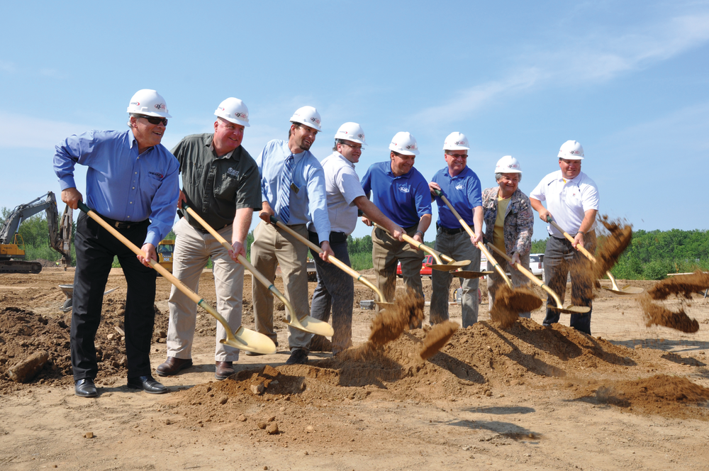 JX Truck Center (JXT) broke ground today for a new state-of-the-art facility in Kronenwetter, Wis. From left to right: Chuck Ghidorzi, President of Ghidorzi Companies (architects and construction firm for the new dealership); Tom Radenz, Owner of REI Engineering; Randy Fifrick, Community Development and Zoning Administrator for the Village of Kronenwetter; Tom Bay, Service Manager for JXT; Eric Jorgensen, CEO and President of JX Enterprises; Sam Stevenson, General Manager for JXT; Judi Akey, President of the Village of Kronenwetter; and Mike Theiss, Architect for Ghidorzi.