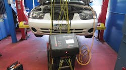 Bleeding the brakes with a brake flush machine. Notice that a battery is not directly on the floor. This is in accordance with EPA regulations in order to prevent fines. For more information on the Flo-Dyamics BrakeMate Jr. check out VehicleServicePros.com/10106064.