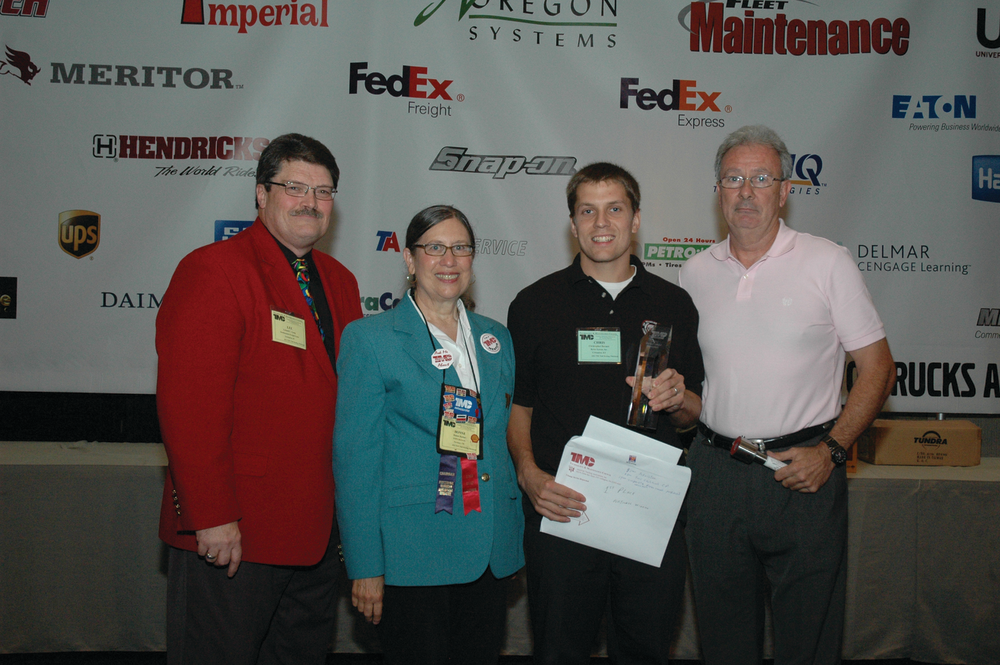 Christopher Barnett of Ryder Systems was named the Grand Champion of the TMCSuperTech 2012 Competition. Pictured left to right with Barnett are TMC General Chairman Lee Long, Professional Technician Development Committee Chairwoman Bonne Karim and George Arrants, TMCSuperTech contest chairman.