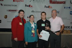 Christopher Barnett of Ryder Systems was named the Grand Champion of the TMCSuperTech 2012 Competition. Pictured left to right with Barnett are TMC General Chairman Lee Long, Professional Technician Development Committee Chairwoman Bonne Karim and George Arrants, TMCSuperTech contest chairman.
