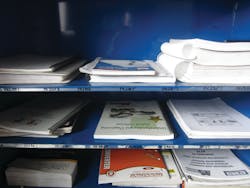 Figure 7: The more information, the better. Here paper manuals are organized for quick reference. Among the more popular paper manuals are Mitchell 1's TPMS reset quick-reference manual and Autodata's manuals on relearns and other procedures, both visible in this picture. Figure 7: The more information, the better. Here paper manuals are organized for quick reference. Among the more popular paper manuals are Mitchell 1's TPMS reset quick-reference manual and Autodata's manuals on relearns and other procedures, both visible in this picture.