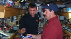 A customer examines a new pair of pliers.