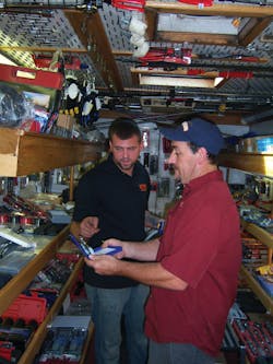 A customer examines a new pair of pliers. A customer examines a new pair of pliers.