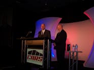 Bill Moss, left, CARS chairman, joins Ron Nagy, NACE chairman, in welcoming attendees to the opening general session of Automotive Service &amp; Repair Week at the Morial Convention Center in New Orleans, La.