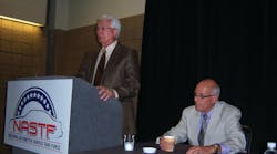 Ron Pyle, chairman of NASTF, at left, announces Skip Potter as the NASTF&apos;s first executive director during the ASRW show in New Orleans.