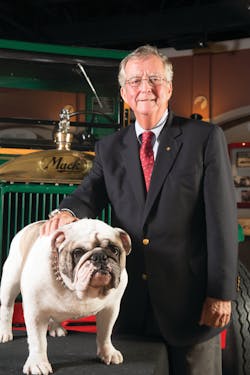 Kevin Flaherty, president, Mack Trucks North American Sales &amp; Marketing, with Mack the Bulldog and the iconic Bulldog hood ornament in the background. A patent for the hood ornament was granted Oct. 11, 1932 &ndash; 80 years ago today.