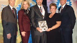 Mark Herman, third from left, accepts his award from Tim Zilke, ASE president and Kristen Davis of Delmar. Second from right is Herman&apos;s wife, Janet; at right is Greg Clayton of Delmar.