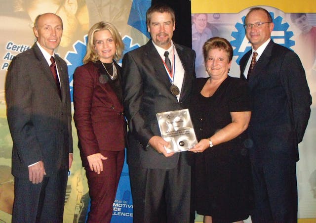 Mark Herman, third from left, accepts his award from Tim Zilke, ASE president and Kristen Davis of Delmar. Second from right is Herman&apos;s wife, Janet; at right is Greg Clayton of Delmar.