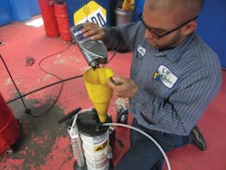 Figure 6: Filling a MityVac fluid extractor with OE transmission fluid for a tranny service one a 2010 VW diesel. Figure 6: Filling a MityVac fluid extractor with OE transmission fluid for a tranny service one a 2010 VW diesel.