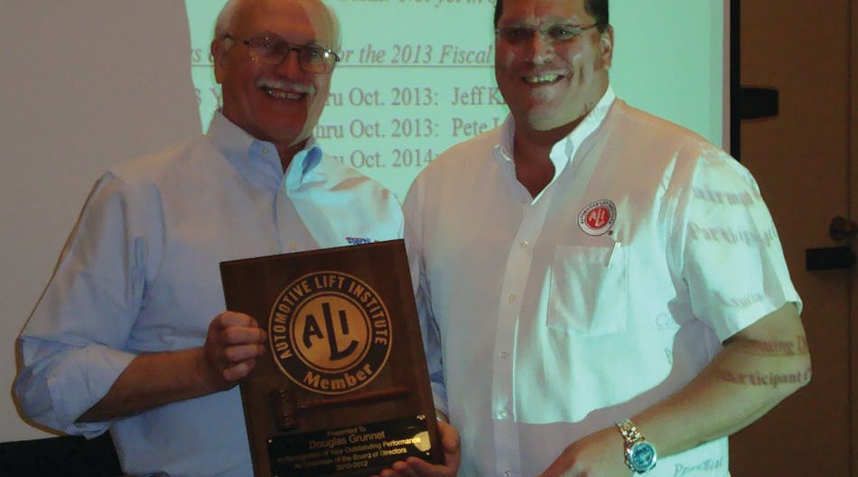 ALI President R.W. (Bob) O&rsquo;Gorman, right, presents a service plaque to outgoing ALI Chairman Douglas Grunnet at the organization&rsquo;s recent annual meeting.