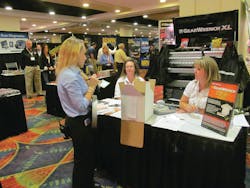 The &apos;prize girl&apos; announces a raffle winner at the 2012 MEDCO show in Philadelphia.