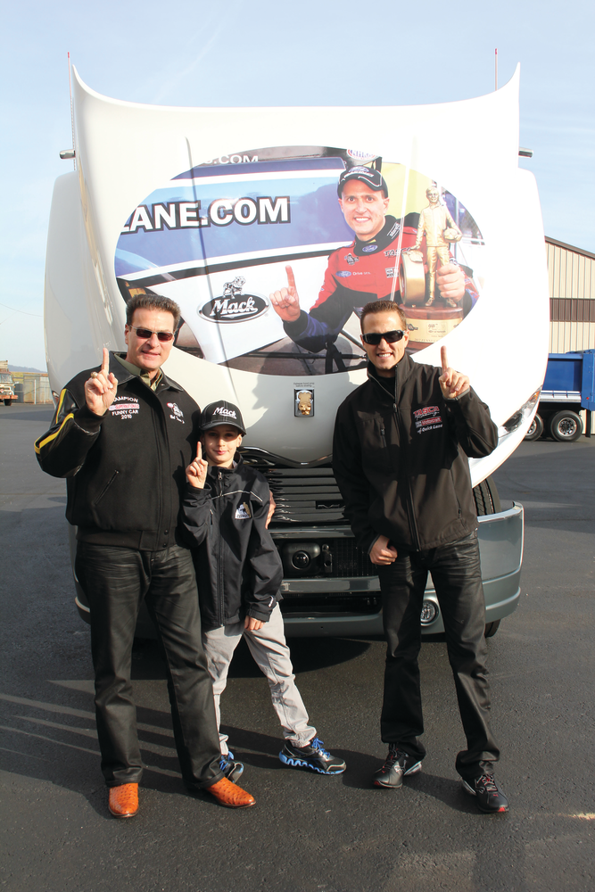 Bob Tasca Jr., Bob Tasca IV and Bob Tasca III, driver and owner of Tasca Racing, a National Hot Rod Association Mello Yello Series race team, pose with the custom-designed Mack Pinnacle model at the Mack Customer Center.