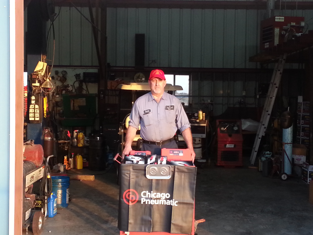 David Coleman, Sr. of DC Auto & Truck Repair (Mamou, La.) shows off the Chicago Pneumatic Tool Package he won.