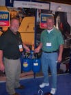 Karl Mathis, left, of Ritchie Engineering shows a Yellow Jacket mobile flushing tool to Roger Smith of Truck Air Service in Columbus, Ga.