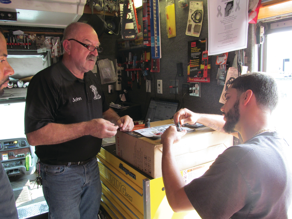 Seybold built up his business by maintaining excellent customer relations. Here, he is taking in a warranty.