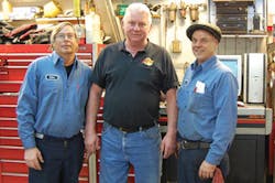 Charles &apos;Chuck&apos; Benart, pictured center, co-owner of Roselle, Ill.-based Auto Tech &amp; Body, passed away on March 25. He&apos;s pictured with two employees, Dave Holmes (left) and Rollin Hansen (right).