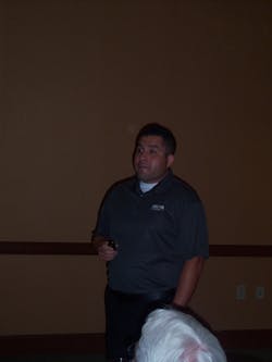 Erick Esparza explains the various benefits of the Innova Pro line to Ace Tool Co. expo attendees.