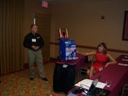 Joe Mocerino and Kim Cottle of Associated Equipment discuss the benefits of AGM batteries during the Ace Tool Co. dealer expo.