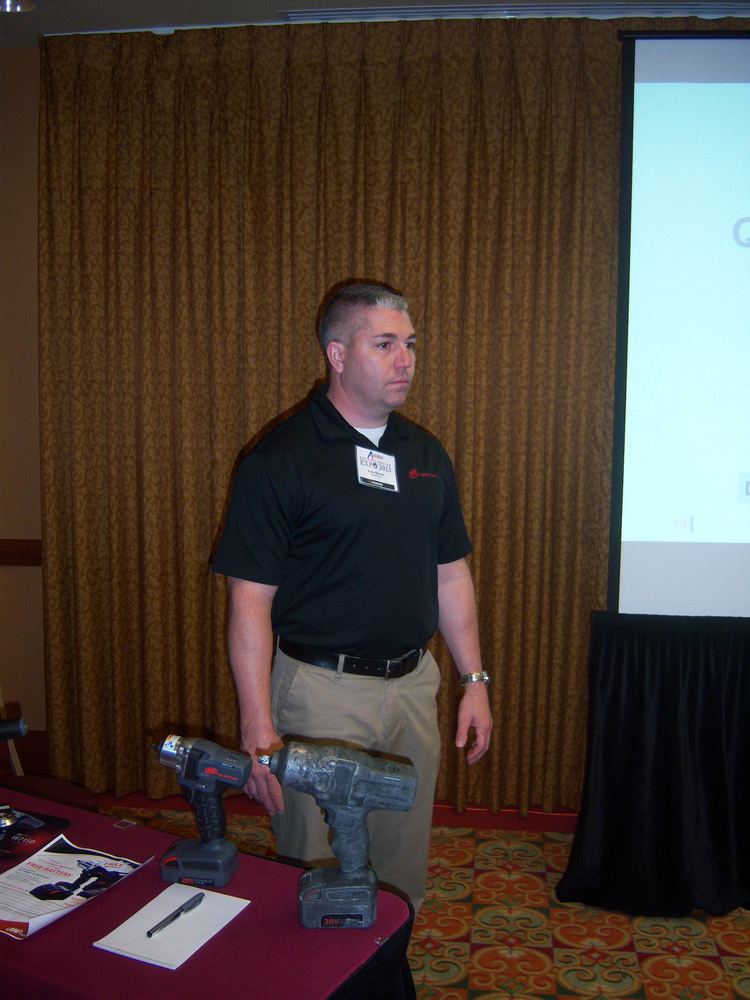 Andy Mandel of Ingersoll Rand answers questions about cordless power technology during the Ace Tool Co. national dealer expo in St. Petersburg, Fla.
