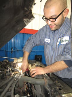 Portillo showing how the cordless ratchet can get into a tight spot. Portillo showing how the cordless ratchet can get into a tight spot.