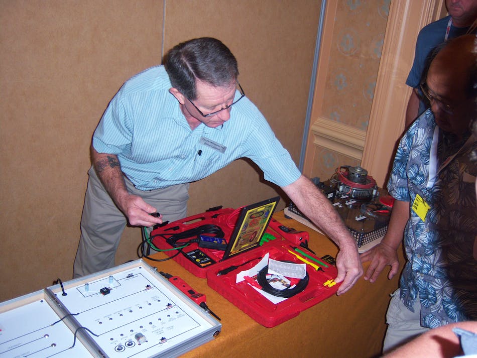 Jaime Lazarus demonstrates the capabilities of Power Probe tools during the ISN show in Orlando, Fla.
