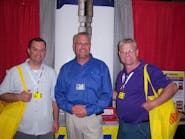 Patrick Wilson, left, and Joe Gyarmati III, right, of Mighty Distributing in Cincinnati, Ohio learn about Ken Tool tools from Rock Tyson.