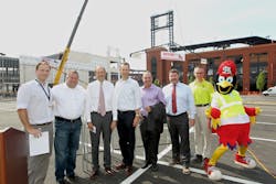 At St. Louis Ballpark VIllage topping off ceremony, event emcee, Todd Yates, President of Wolverine celebrates a construction milestone with Bill DeWitt III, President of the Cardinals, Chase Martin, Ballpark Village Director of Development, Keith Walkoff, President of Paric along with other civic officials and project partners.