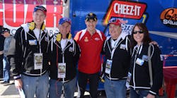 Penske racing driver Joey Logano, center, welcomes, at left, Dylan Larson, Lonny Larson, Mike Murphy and Misty Edwards.