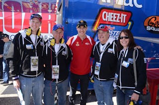 Penske racing driver Joey Logano, center, welcomes, at left, Dylan Larson, Lonny Larson, Mike Murphy and Misty Edwards.