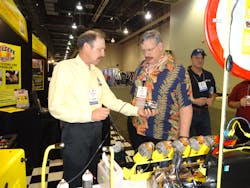 Bernie Thompson, left, of Automotive Test Solutions shows the Bullseye leak detector system, which can detect small leaks, at the 2013 AAPEX show. Bernie Thompson, left, of Automotive Test Solutions shows the Bullseye leak detector system, which can detect small leaks, at the 2013 AAPEX show.
