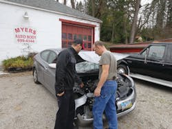A technician shows Manning where the engine mount was broken off the engine. A technician shows Manning where the engine mount was broken off the engine.