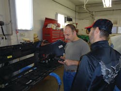 A customer looks at a 1/4' air ratchet Manning brought into the shop. A customer looks at a 1/4' air ratchet Manning brought into the shop.