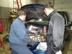 A technician shows Manning a broken bolt he had to extract. A technician shows Manning a broken bolt he had to extract.