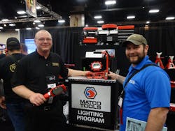 Steve Bailey, left, of SFA Companies, Inc. presents the 10W COB aluminum cordless light to Nick Bowden of Watertown, S.D.