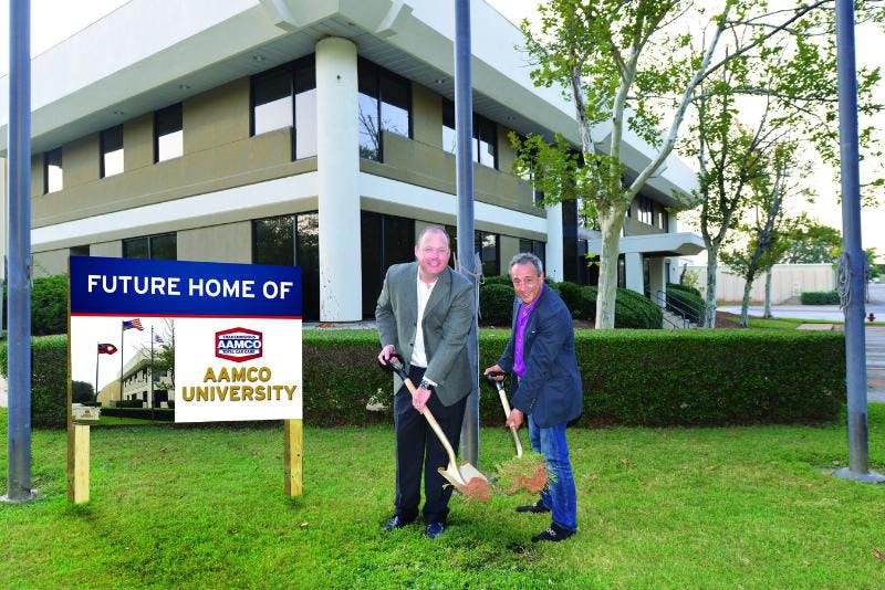 AAMCO President and Chief Executive Officer Brett Ponton and Mike Ganjei, president of the National AAMCO Dealers Association, break ground at AAMCO University.