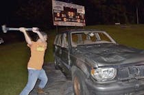 Seth Dalton, a student of the Skills program at South Campus, lets loose with a hammer at a football game in fall 2014.