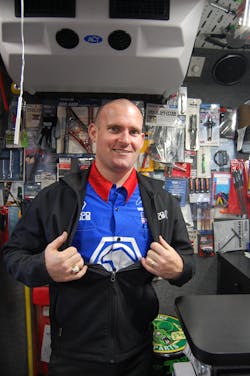 Wineinger proudly displays his racing shirt, signed by NHRA drag racer Antron Brown. Wineinger proudly displays his racing shirt, signed by NHRA drag racer Antron Brown.