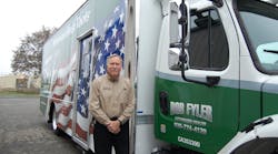 Independent distributor Bob Fyler stands next to his America&apos;s Best Tools-wrapped truck.