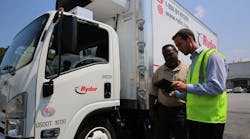 Ryder employees at the company&rsquo;s rental facility in Doraville, Ga. review the Rental Signature Capture app on a tablet.