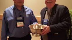 Rick Clemence (left), newly elected president of the Hand Tools Institute presents Earl Cunningham (right), the HTI Presidents Bowl in appreciation of his leadership and service to HTI.