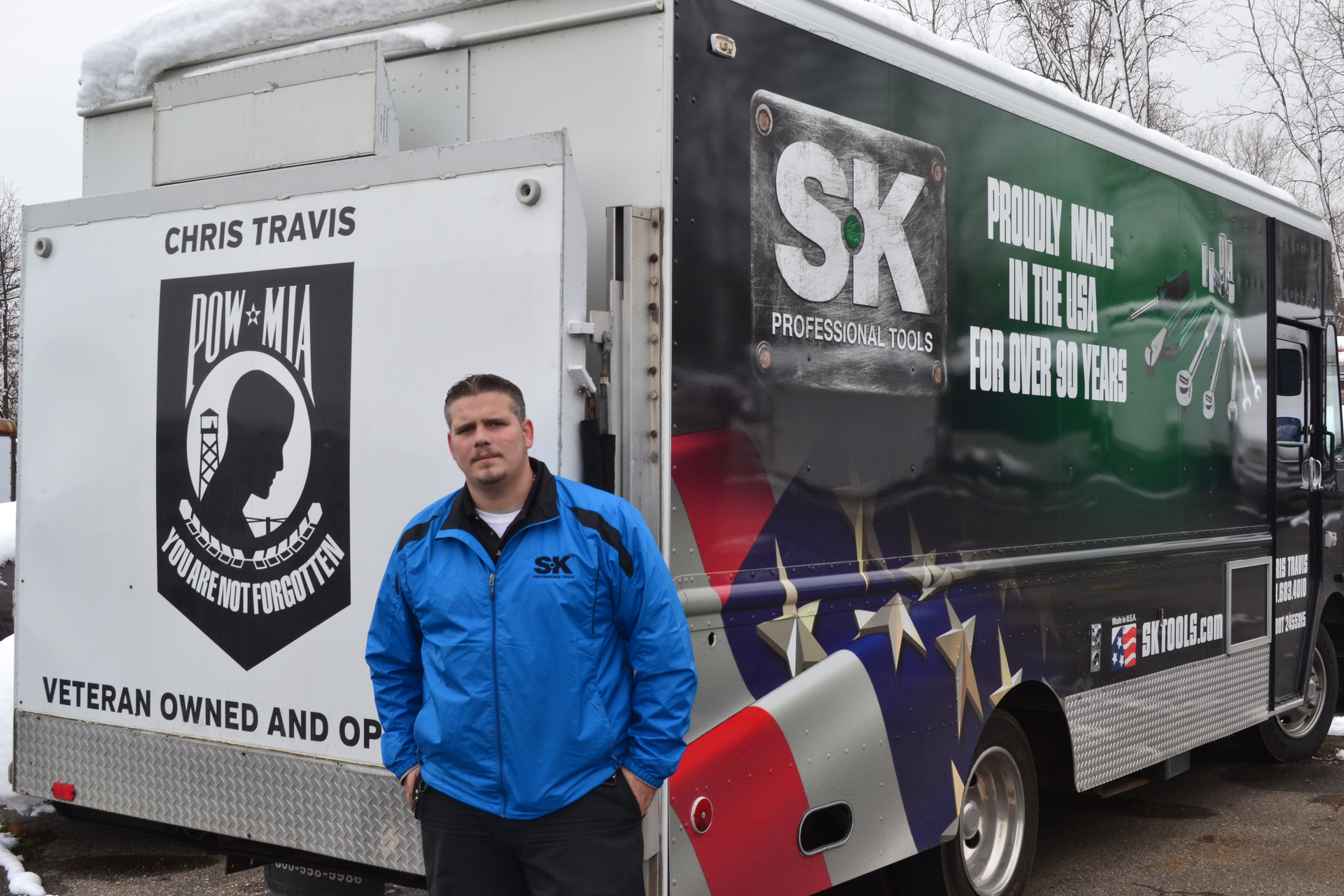 Independent distributor Chris Travis in front of his truck, which was wrapped by SK Tools.