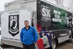 Independent distributor Chris Travis in front of his truck, which was wrapped by SK Tools. Independent distributor Chris Travis in front of his truck, which was wrapped by SK Tools.
