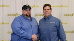Julian Kaczor, winner of the 33rd Goodyear Highway Hero Award shakes hands with Gary Medalis, Goodyear marketing director.
